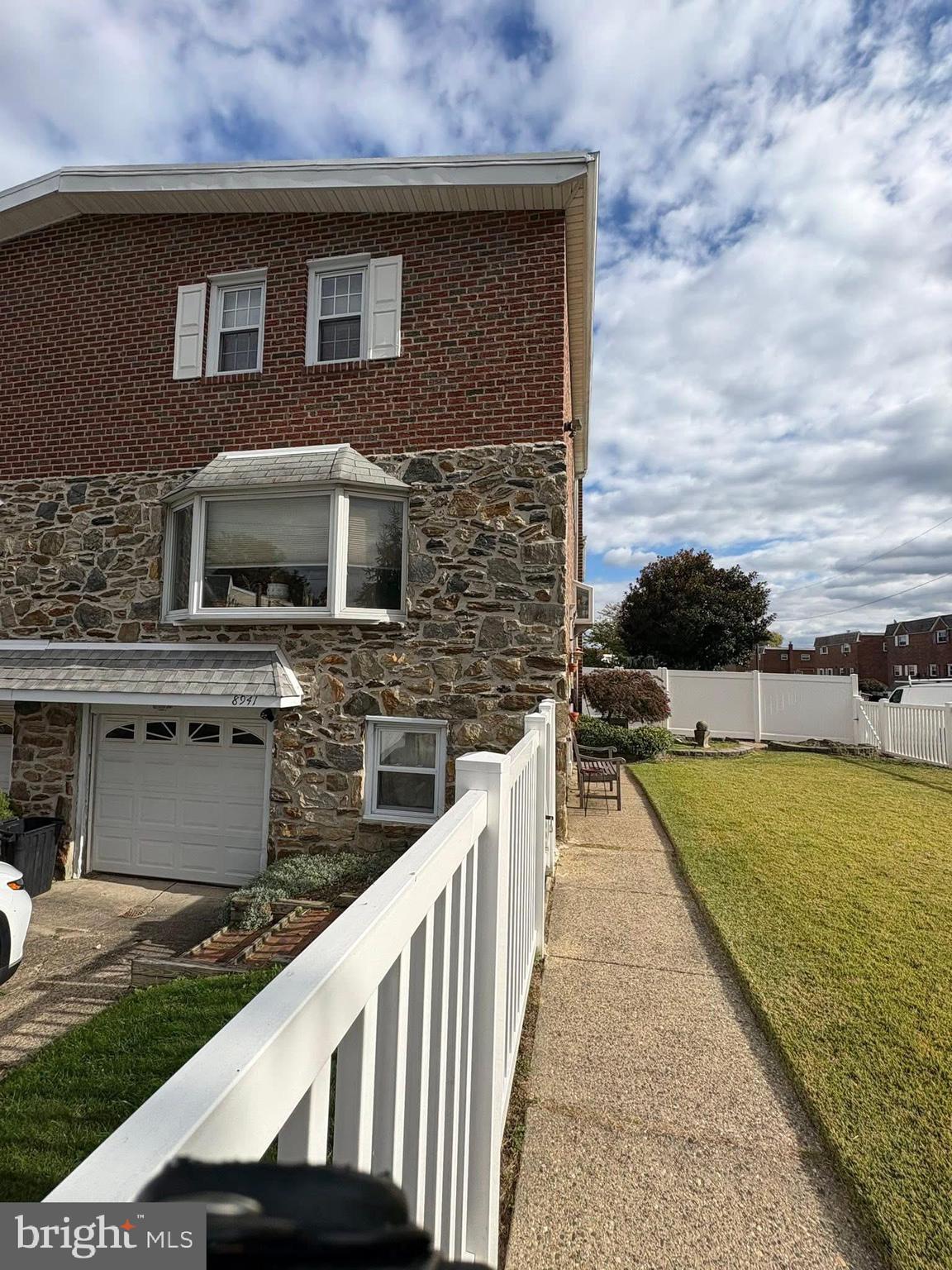 a view of a brick house with a ocean view