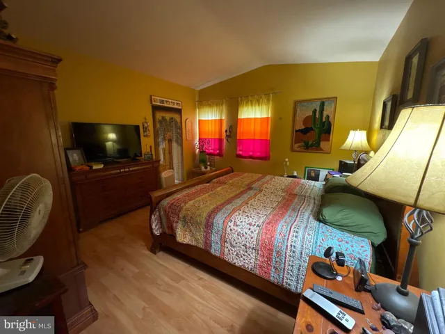 a bedroom with a bed and dresser