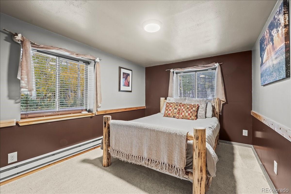 1119 Venture Road Fairplay, CO 80440 - Photo 36 of 49 a bedroom with a bed and a window