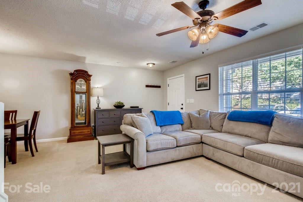 8210 Rudolph Road Charlotte, NC 28216 - Photo 2 of 11 a living room with furniture and a large window