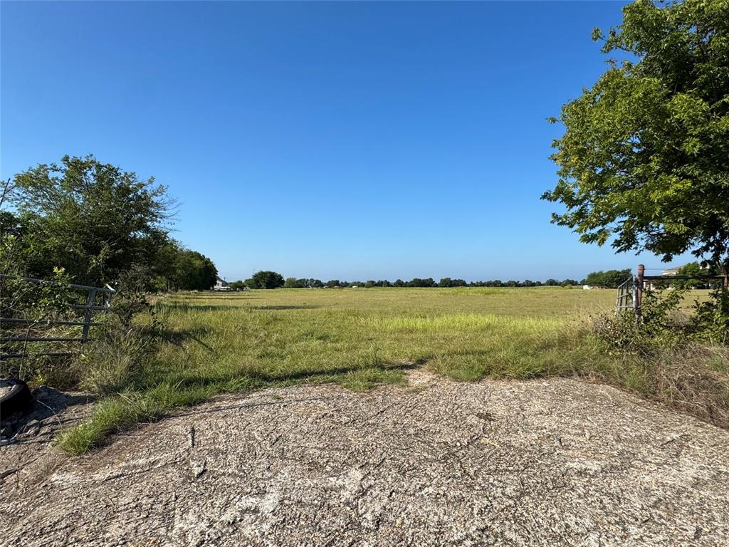 Lot 1-919 West Hillyard Road Troy, TX 76579 - Photo 8 of 9 a view of a lake from a yard