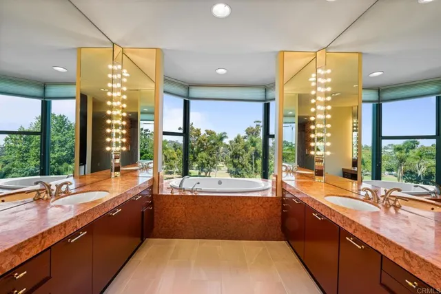 a large kitchen with kitchen island a large window