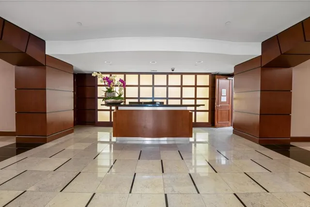 a view of kitchen with furniture and refrigerator
