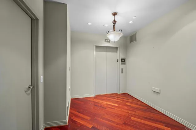 a view of empty room and wooden floor