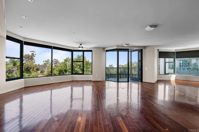 a view of an entryway with wooden floor