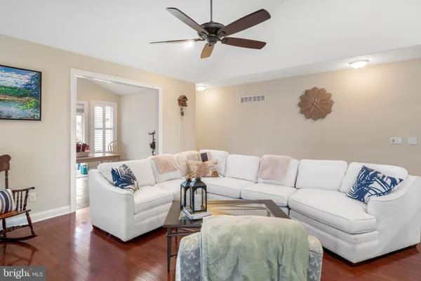 a living room with couches and a coffee table