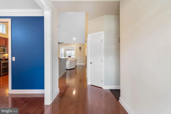 a view of a room with wooden floor