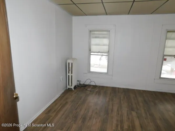 a view of an empty room and window