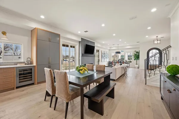 a dining room with furniture and a kitchen view