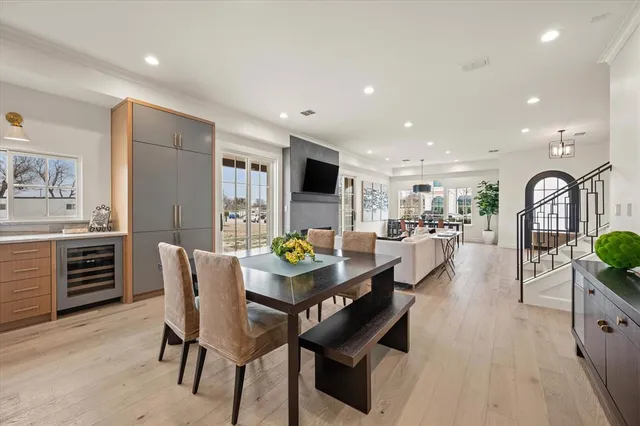 a dining room with furniture and a kitchen view