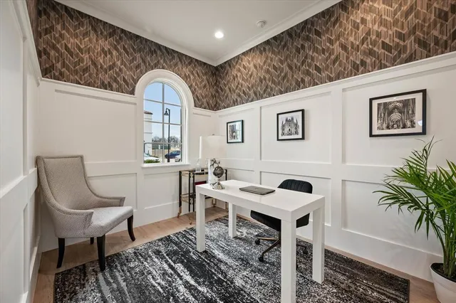 a view of a workspace room with furniture and lots of space