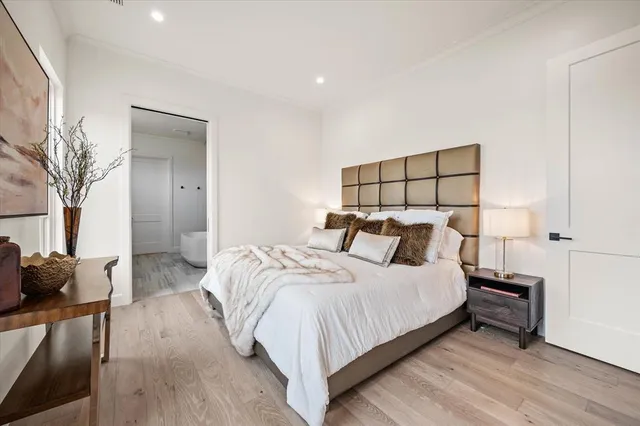 a bedroom with a bed and a couch