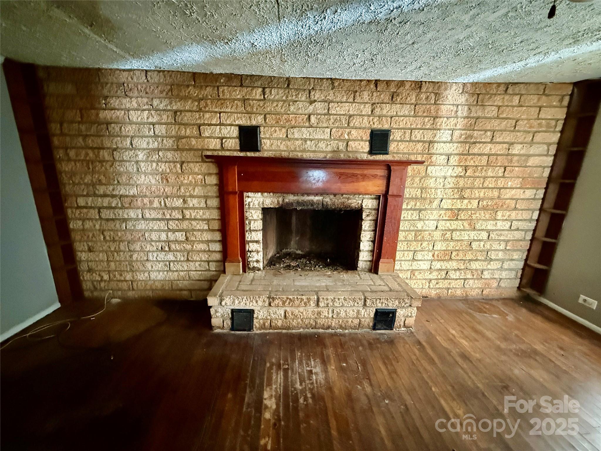 602 Green Chapman Road Gastonia, NC 28056 - Photo 3 of 10 a living room with a fireplace