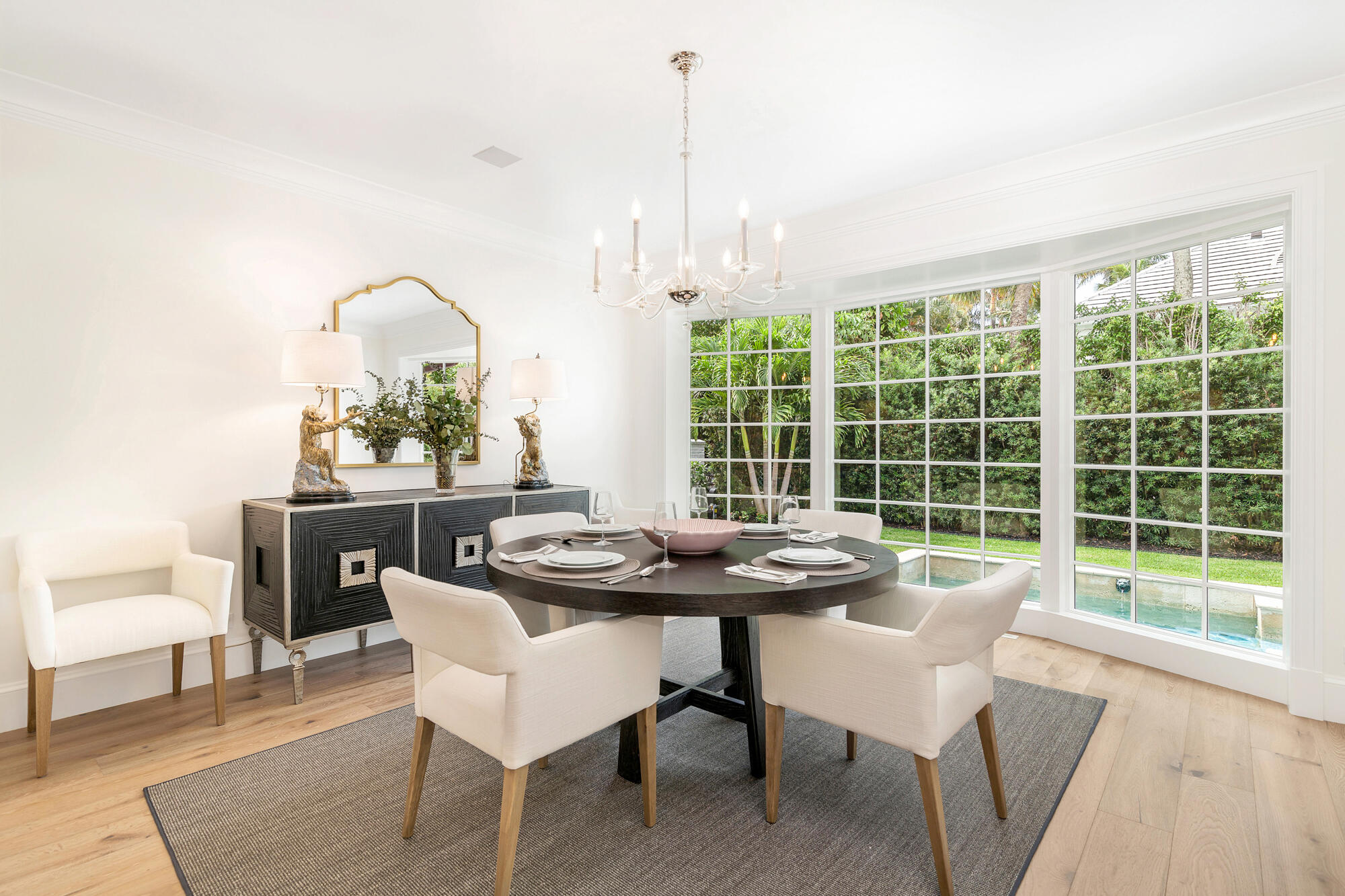 236 Pendleton Avenue Palm Beach, FL 33480 - Photo 14 of 34 a dining room with furniture a chandelier and wooden floor