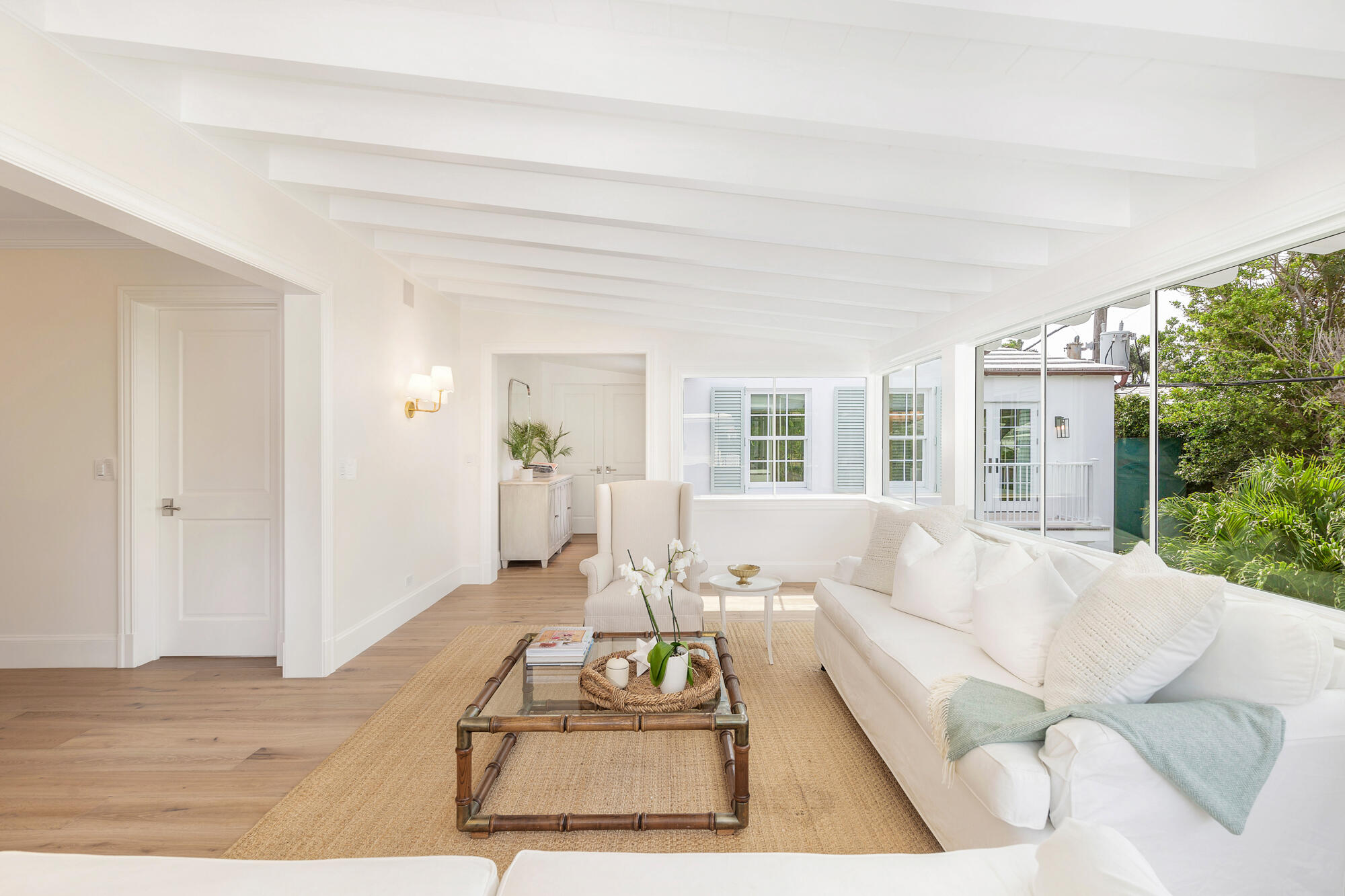 236 Pendleton Avenue Palm Beach, FL 33480 - Photo 20 of 34 a living room with furniture large window and a wooden floor