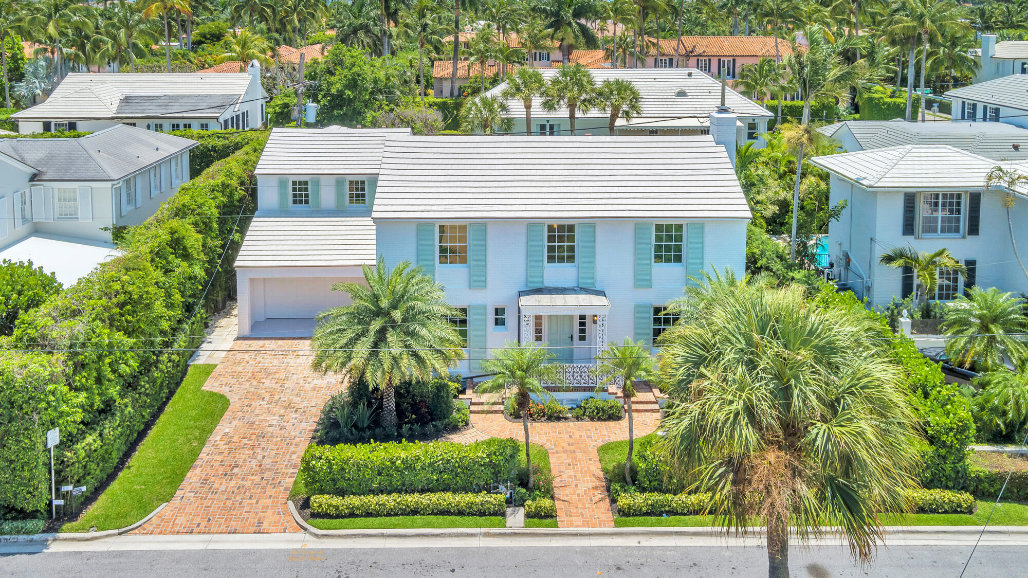 236 Pendleton Avenue Palm Beach, FL 33480 - Photo 33 of 34 a front view of a house with a yard and trees