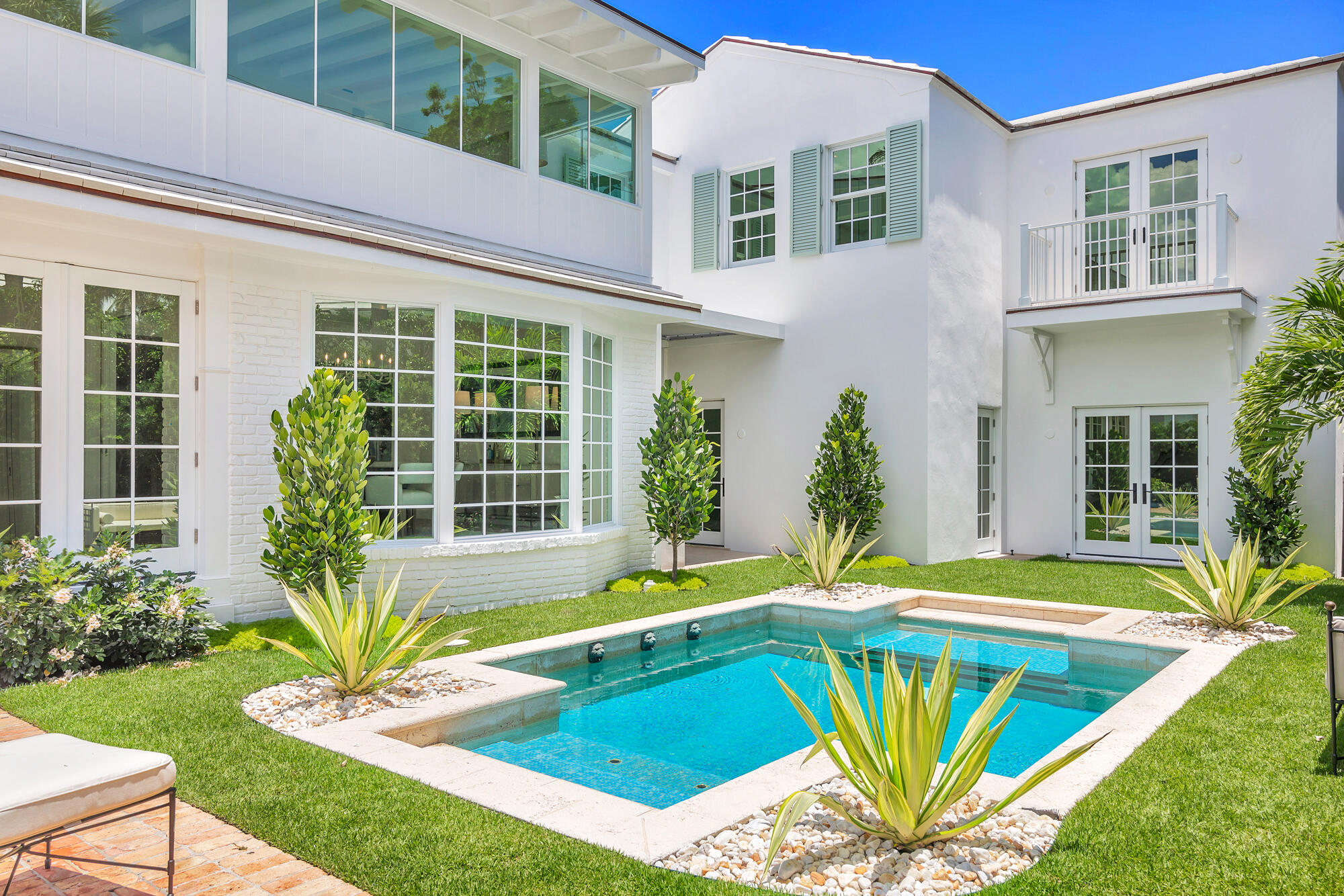 236 Pendleton Avenue Palm Beach, FL 33480 - Photo 5 of 34 a view of a house with pool and sitting area