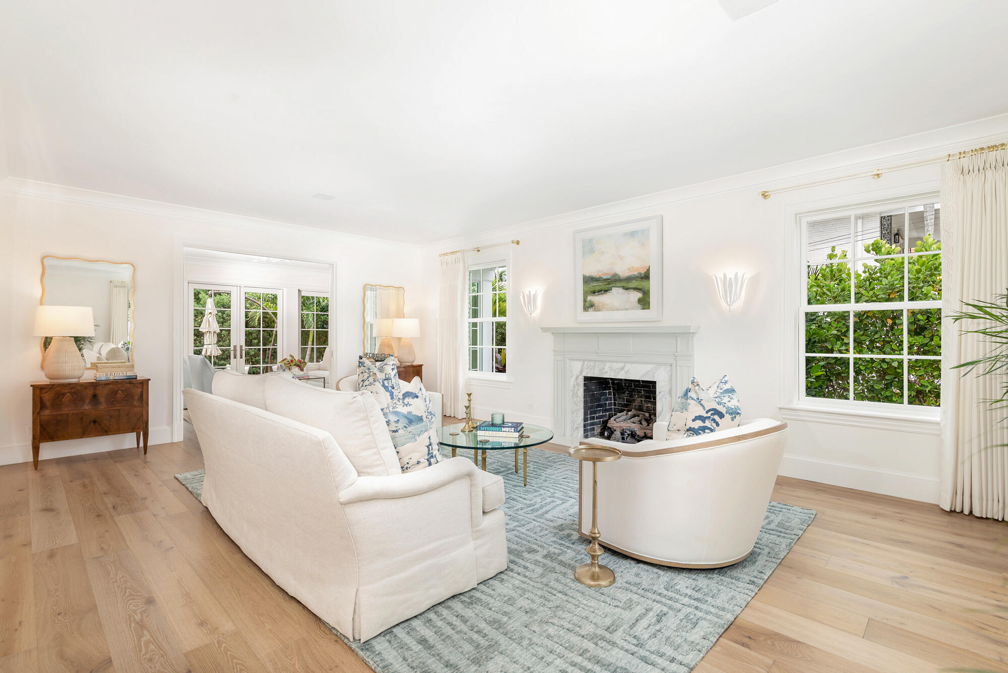 236 Pendleton Avenue Palm Beach, FL 33480 - Photo 8 of 34 a living room with furniture a fireplace and a large window