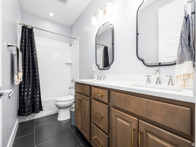 877 South Yarrow Drive Mapleton, UT 84664 - Photo 28 of 46 Dual vanity featuring a white countertop, undermount sinks, and bronze-finish hardware