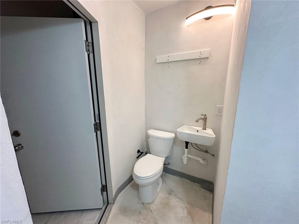 137 Meta Street Fort Myers, FL 33905 - Photo 17 of 50 Half bath with a sink and toilet
