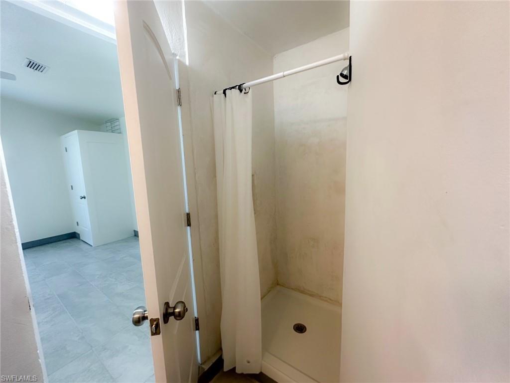137 Meta Street Fort Myers, FL 33905 - Photo 18 of 50 Bathroom featuring a shower stall