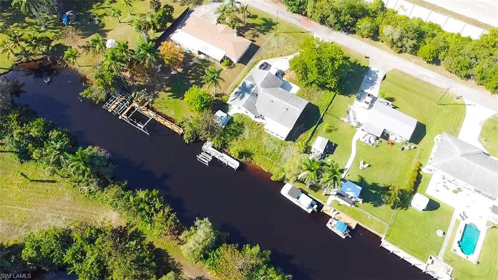 137 Meta Street Fort Myers, FL 33905 - Photo 28 of 50 Aerial perspective of suburban area with a large body of water