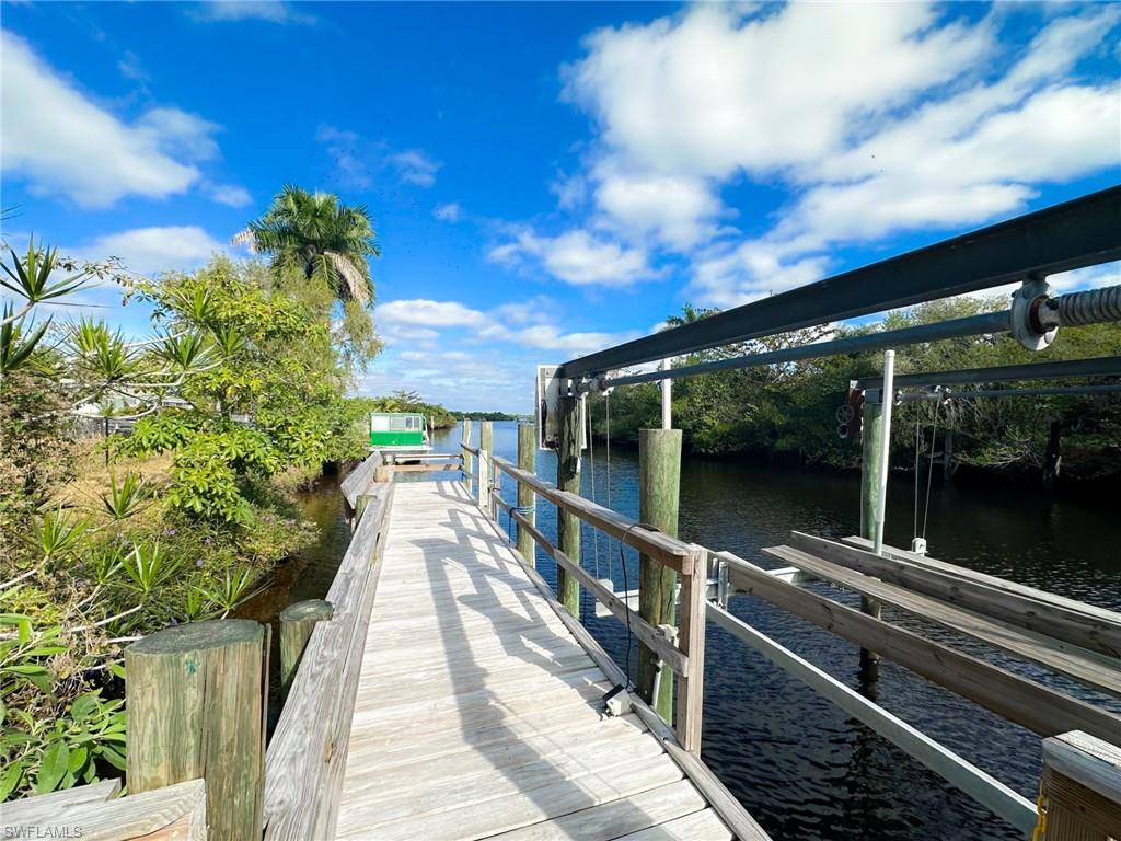 137 Meta Street Fort Myers, FL 33905 - Photo 34 of 50 Dock featuring a water view and boat lift