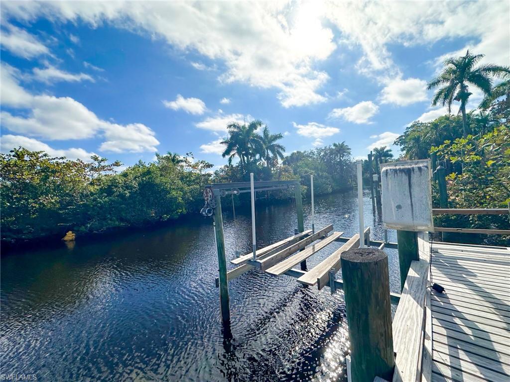 137 Meta Street Fort Myers, FL 33905 - Photo 36 of 50 Dock area featuring boat lift and a water view