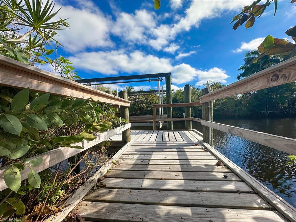 137 Meta Street Fort Myers, FL 33905 - Photo 38 of 50 Dock featuring a deck with water view