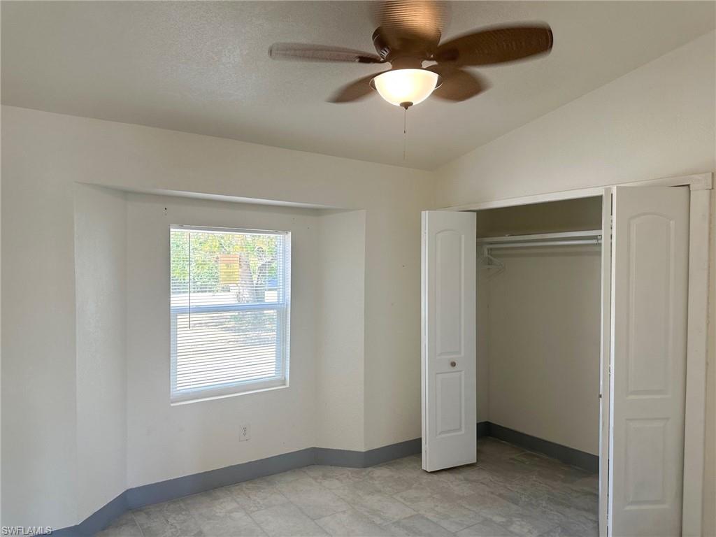 137 Meta Street Fort Myers, FL 33905 - Photo 39 of 50 Unfurnished bedroom with a ceiling fan, a closet, and lofted ceiling