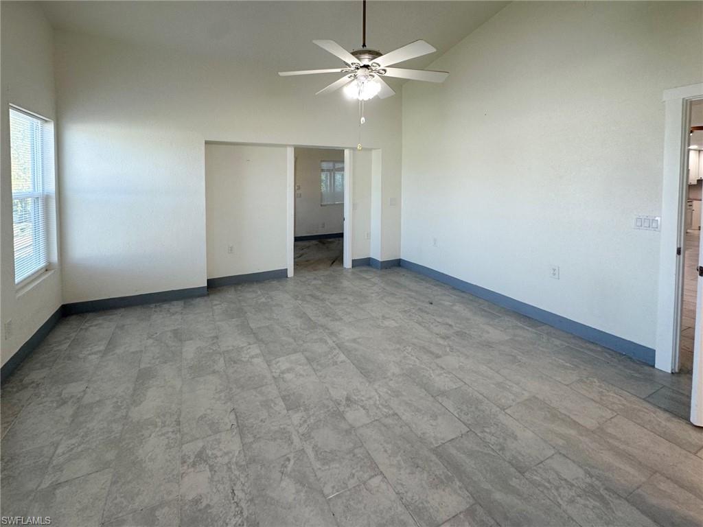 137 Meta Street Fort Myers, FL 33905 - Photo 43 of 50 Unfurnished bedroom featuring high vaulted ceiling and ceiling fan