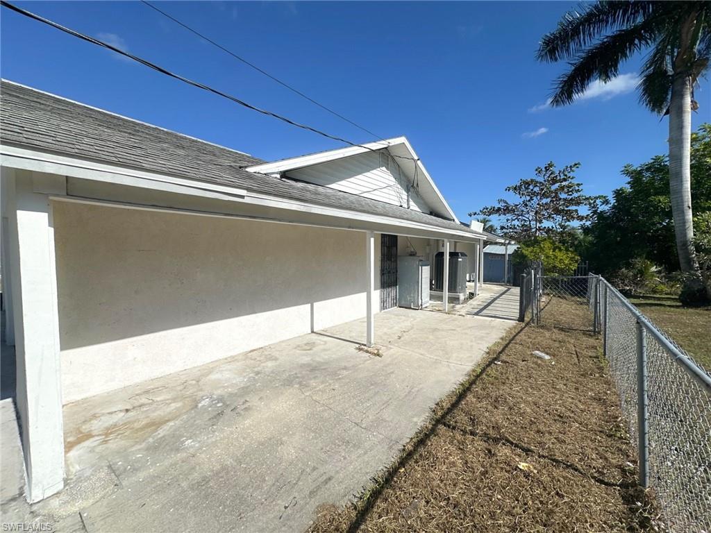 137 Meta Street Fort Myers, FL 33905 - Photo 48 of 50 View of home's exterior with roof with shingles