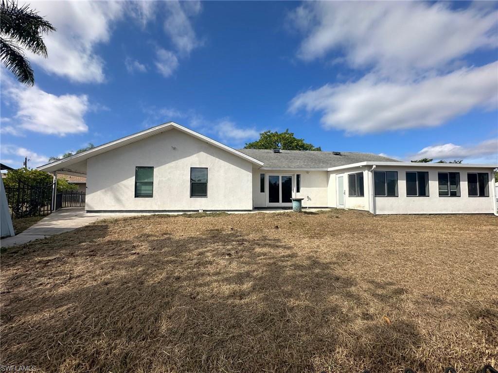 137 Meta Street Fort Myers, FL 33905 - Photo 5 of 50 Back of house featuring a patio area and stucco siding
