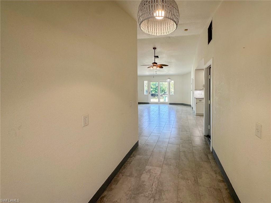 137 Meta Street Fort Myers, FL 33905 - Photo 6 of 50 Corridor featuring baseboards