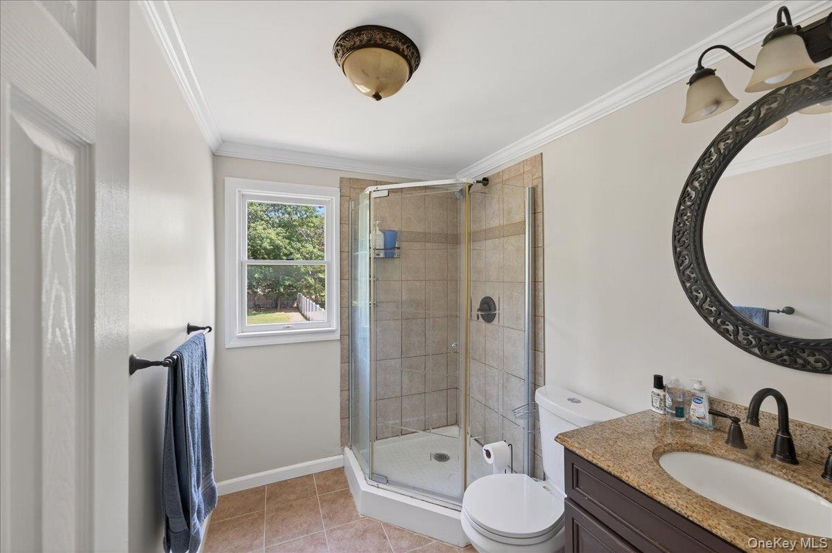 4 Myrtle Lane Coram, NY 11727 - Photo 12 of 20 a bathroom with a granite countertop sink toilet and shower