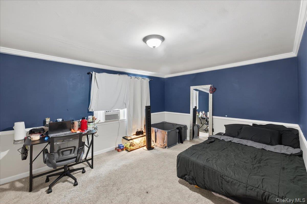 4 Myrtle Lane Coram, NY 11727 - Photo 14 of 20 a bedroom with furniture and a window