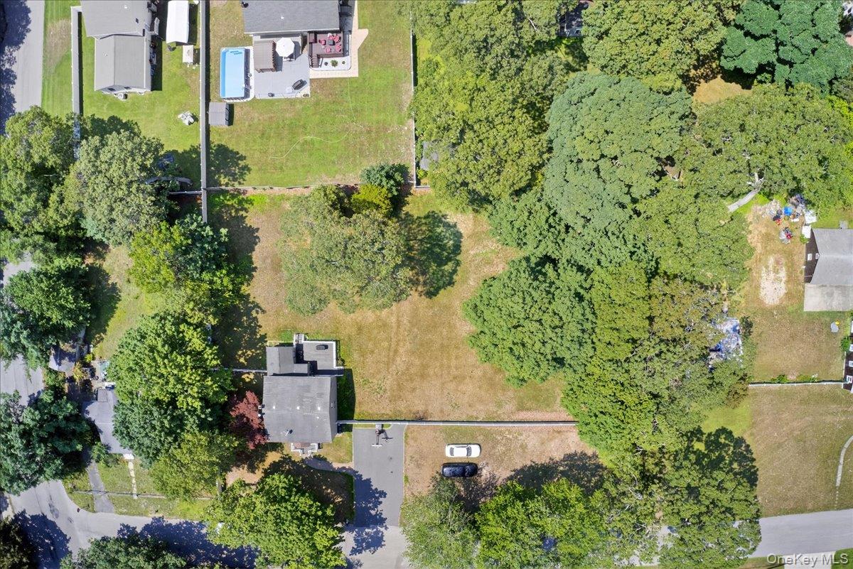 4 Myrtle Lane Coram, NY 11727 - Photo 19 of 20 an aerial view of a house with a yard
