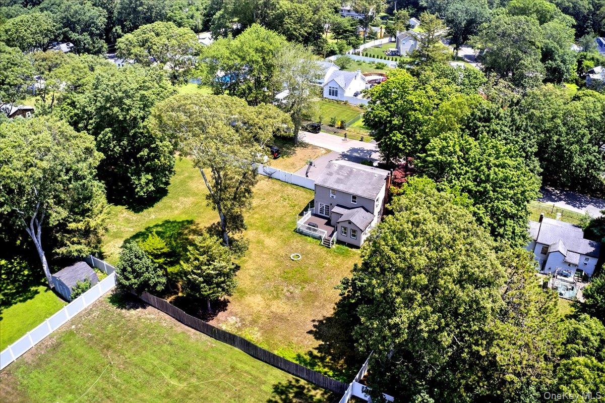 4 Myrtle Lane Coram, NY 11727 - Photo 20 of 20 an aerial view of a house with a yard and swimming pool