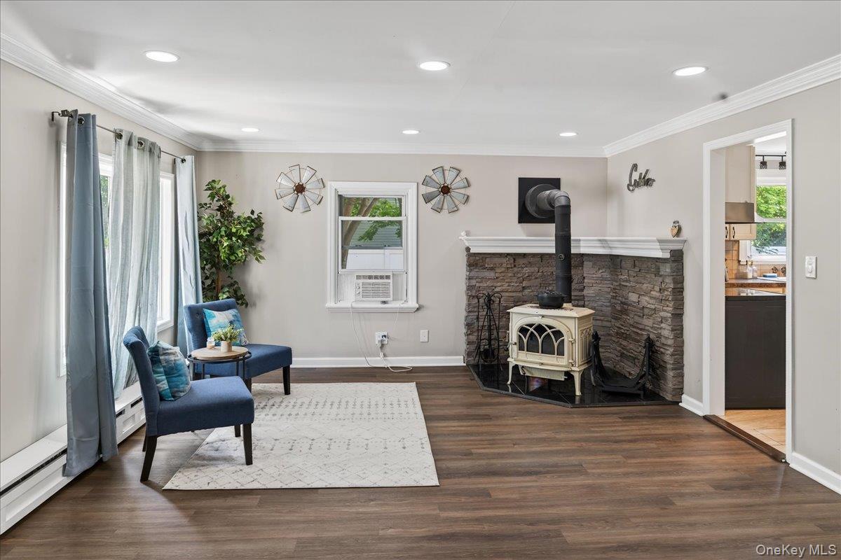 4 Myrtle Lane Coram, NY 11727 - Photo 2 of 20 a living room with furniture and a fireplace