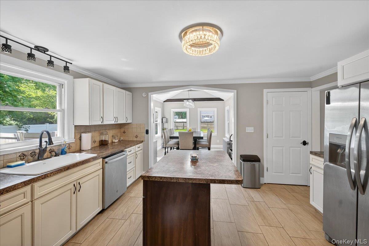 4 Myrtle Lane Coram, NY 11727 - Photo 9 of 20 a kitchen with a sink appliances and cabinets