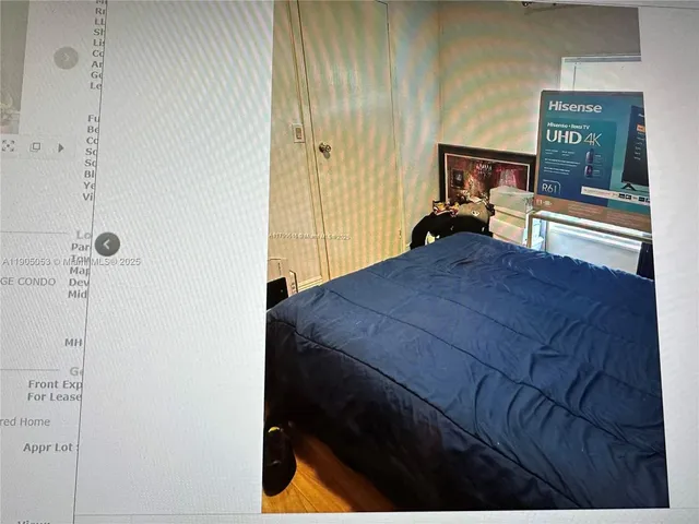 a bathroom with a granite countertop sink and washing machine