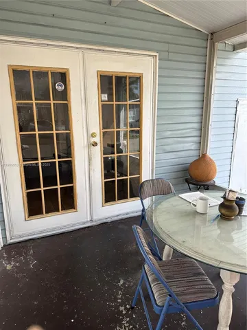 a room with furniture and a book shelf