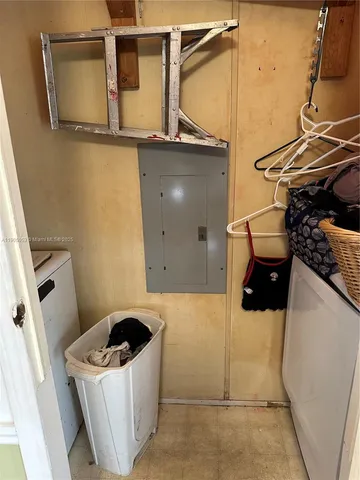 a kitchen with granite countertop a refrigerator stove and microwave
