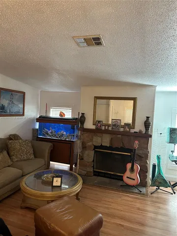 a bedroom with a bed and a television