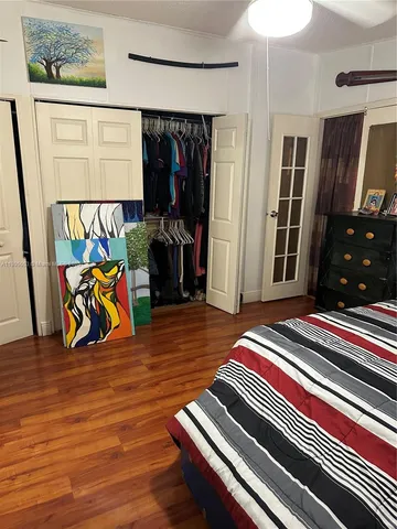 a dining room with furniture and a view of bathroom