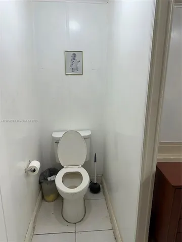 a house with pool in front of it