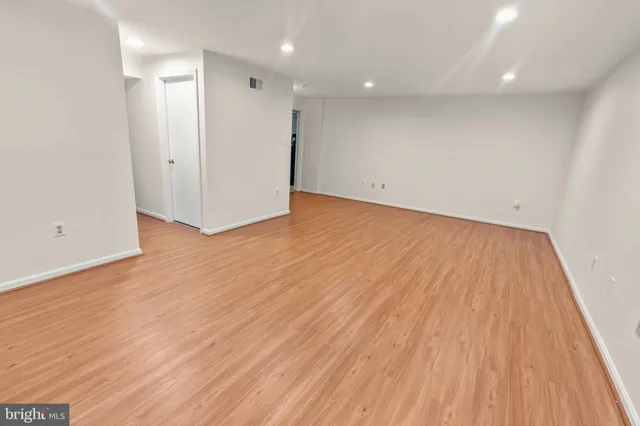 a view of hallway with wooden floor