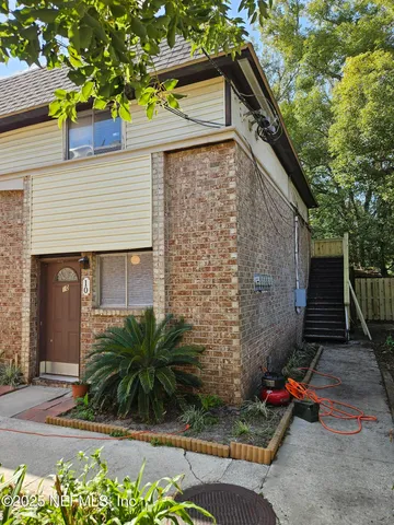a kitchen with stainless steel appliances granite countertop a sink and a refrigerator