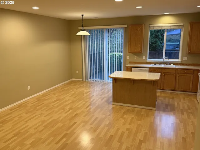 a spacious bathroom with a sink mirror and bathtub