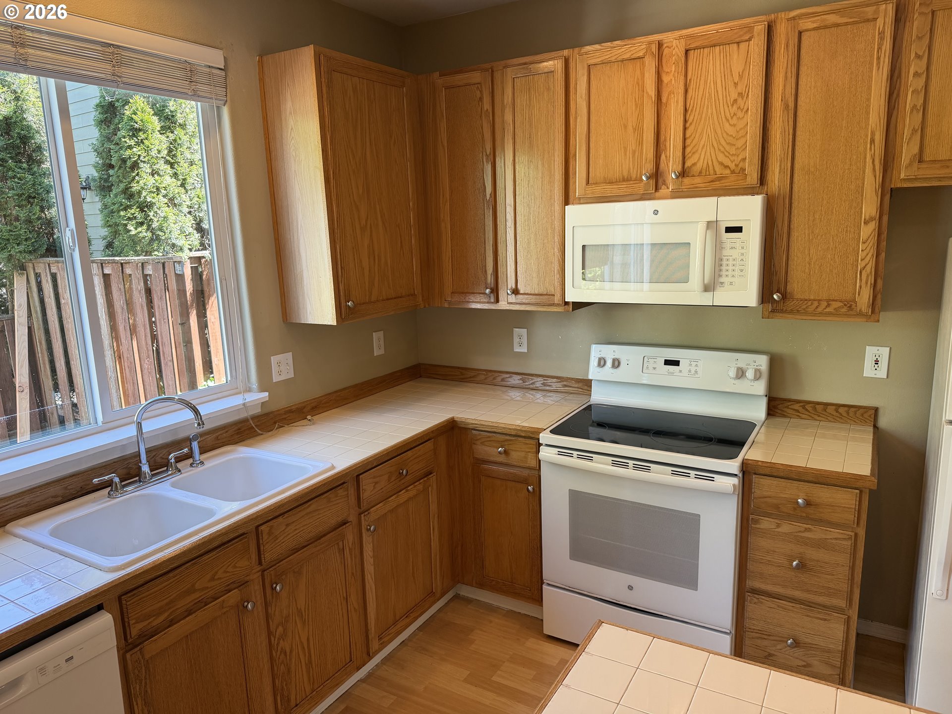 778 Southwest 198th Place Beaverton, OR 97003 - Photo 24 of 24 a kitchen with a stove microwave and sink